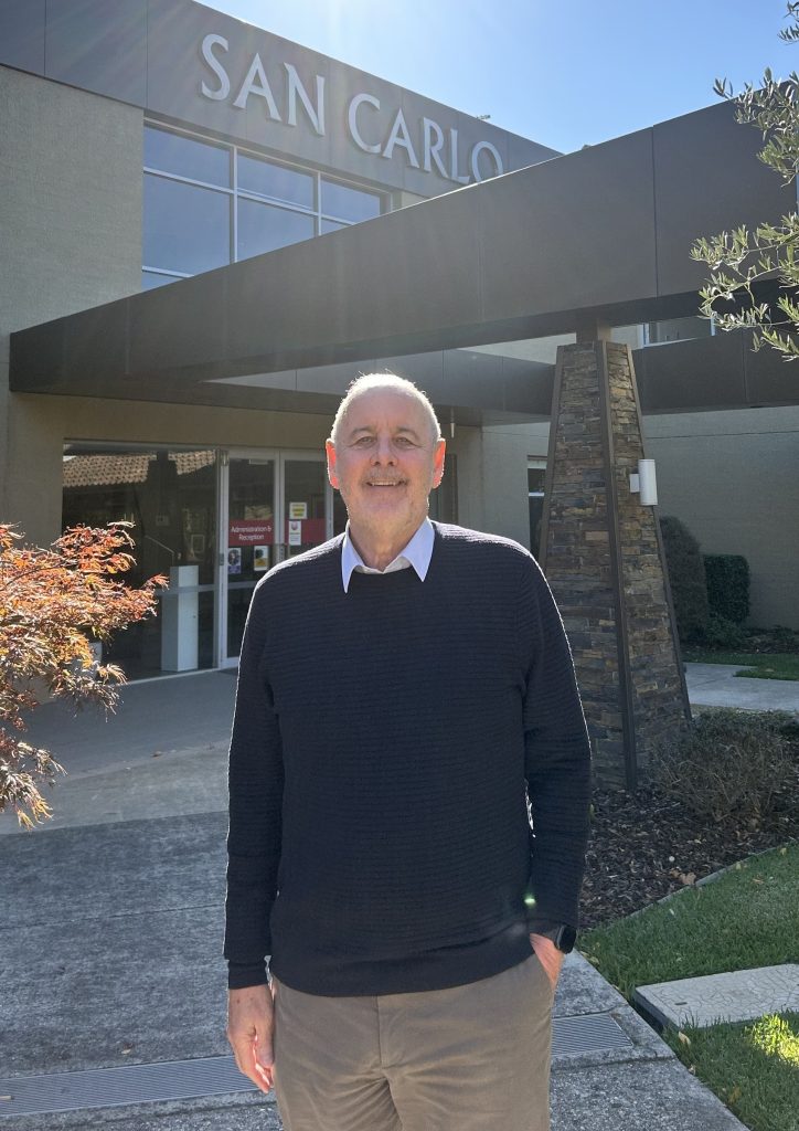 Ron Hooton stands in front of San Carlo Homes for the Aged